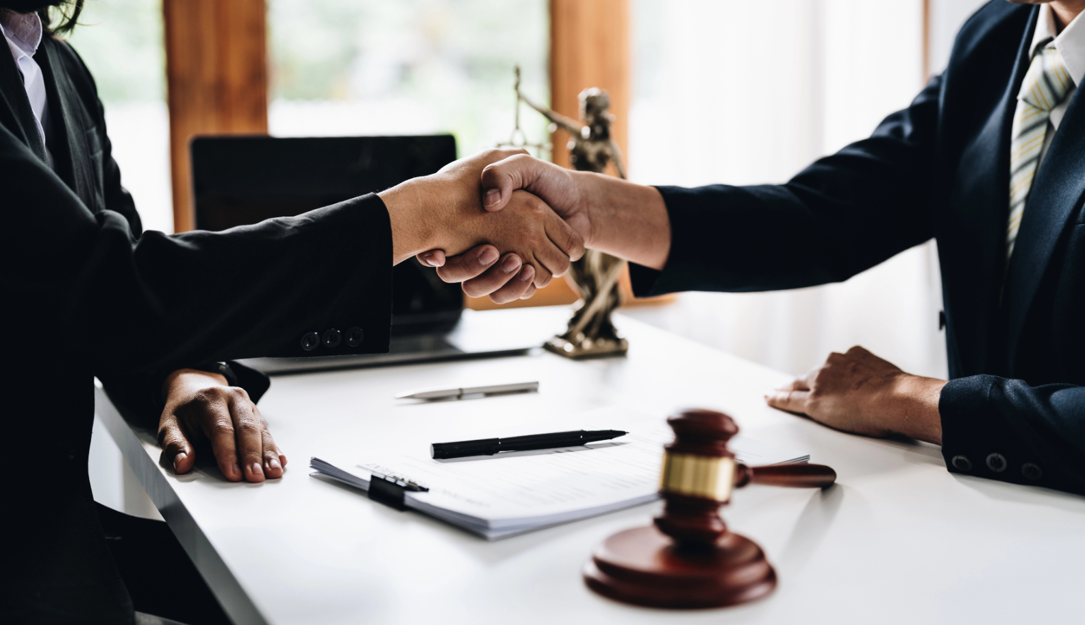Businessman Shaking Hands To Seal